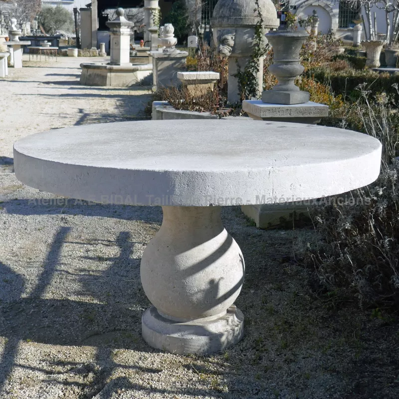 Garden table hand carved in natural French limestone by the master stone cutter of Atelier Alain BIDAL