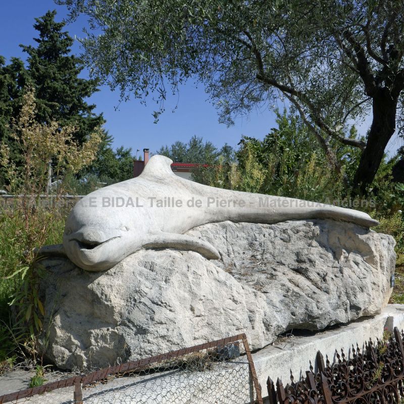 Dolphin hand-sculpted in stone by Atelier Alain Bidal, stonemason in Provence