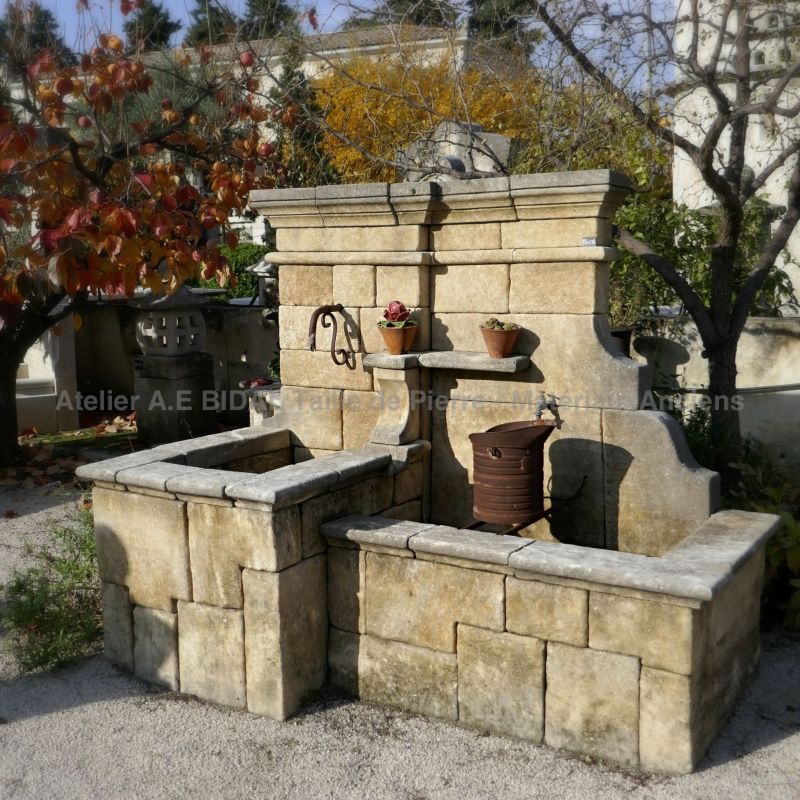 Artisanal wall fountain carved in limestone - Fountain of creation by Atelier Alain Bidal