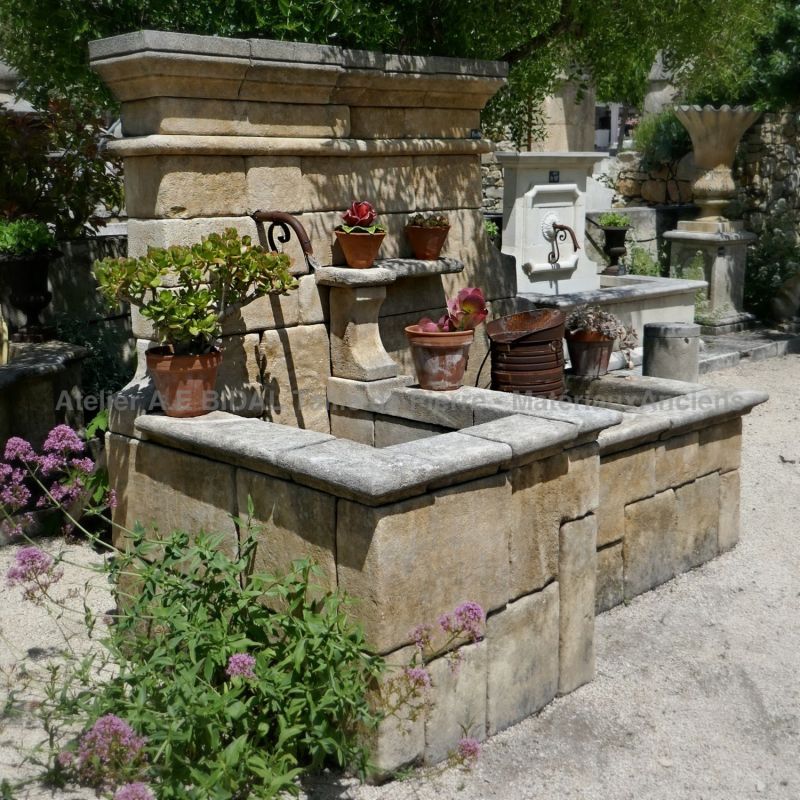 Embellish your garden with a real natural stone fountain on sale in Provence at Atelier Alain BIDAL.