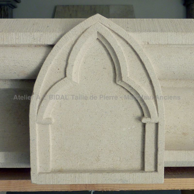 Neogothic style fireplace carved by hand by Atelier Alain BIDAL, Provence.