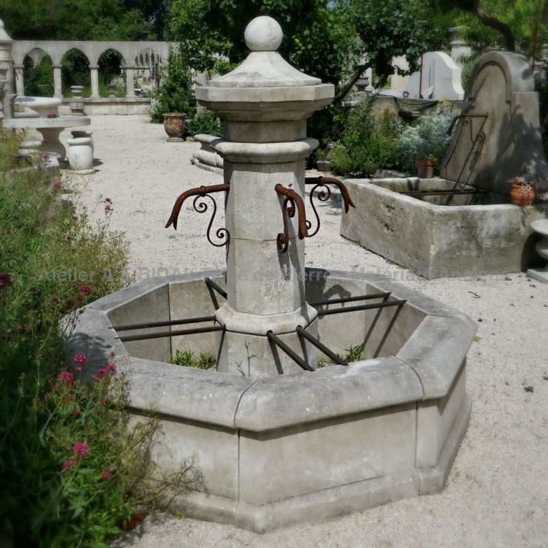 Provence octagonal fountain crafted in French limestone for great landscaping - Atelier Alain BIDAL.