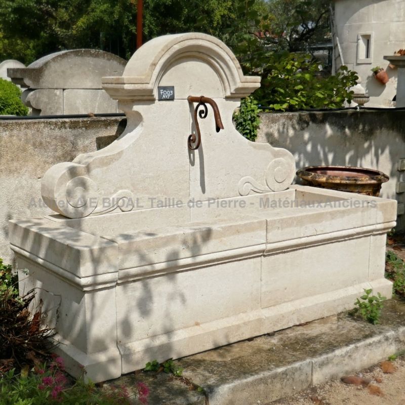 Decorative stone fountain by the artisan stonemason in Provence Alain Bidal.