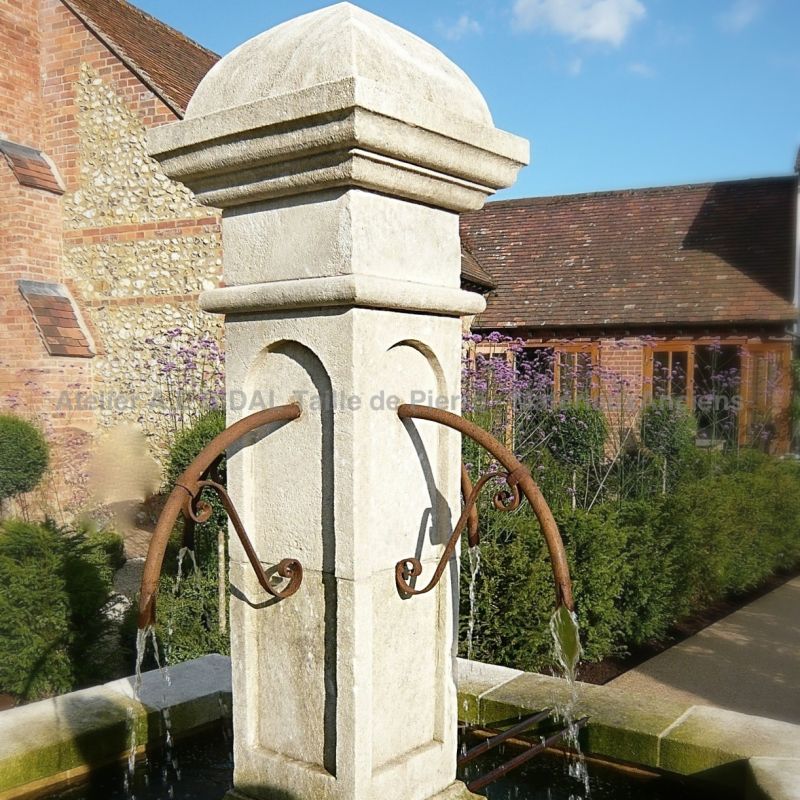 Central column carved by hand on our large garden fountain for sale at Atelier Alain BIDAL - Provence.