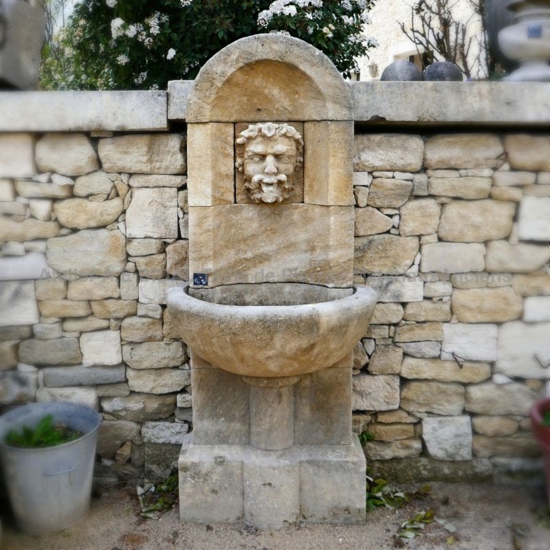 Garden wall fountain crafted in Estaillades stone by Alain BIDAL, Provence.