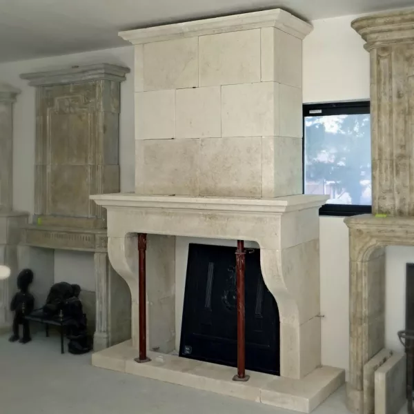 Provencal stone fireplace with trumeau by the manufacturer of stone fireplaces Atelier Alain BIDAL.