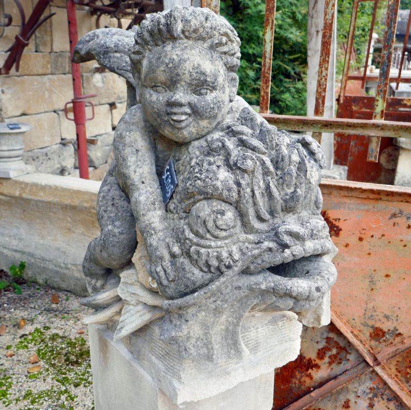 Putto and dolphin : beautiful hand-crafted sculpture in patinated Provence stone