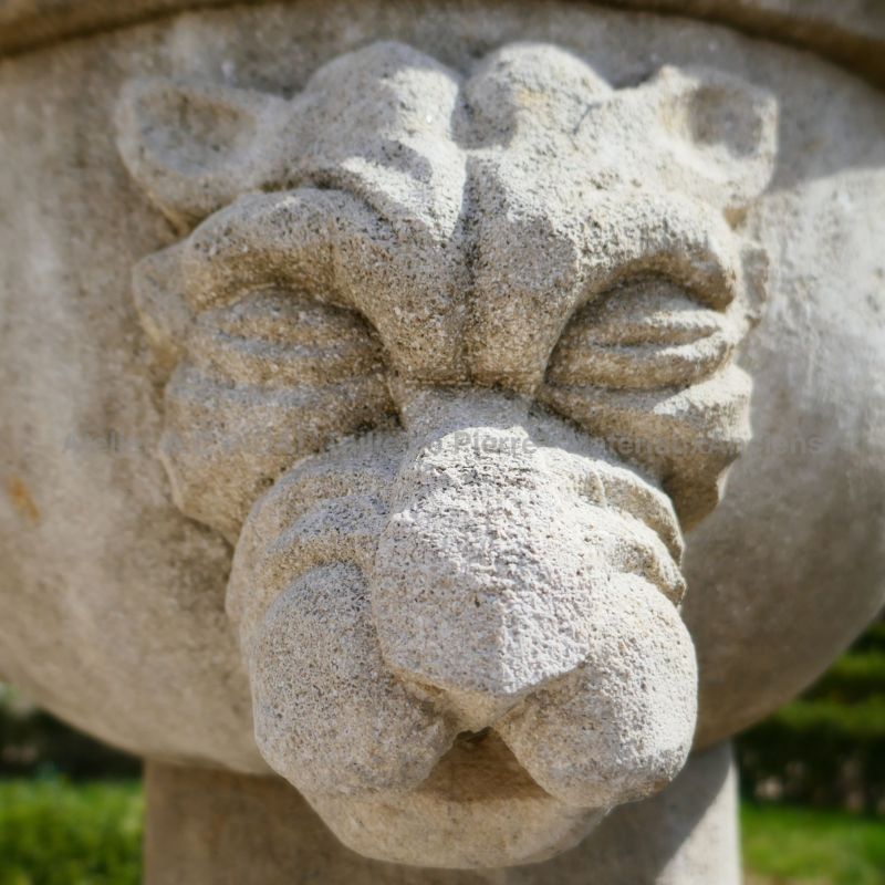 Gothic fountain in weathered limestone crafted by the stone mason Alain BIDAL, Provence