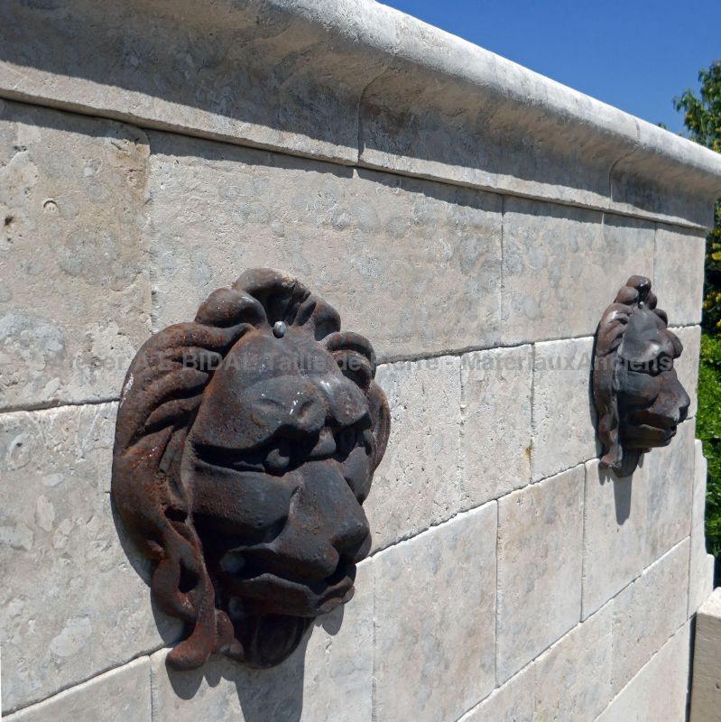 Pediment from our stone fountain with cast iron lion heads as water outlets - Atelier Alain BIDAL