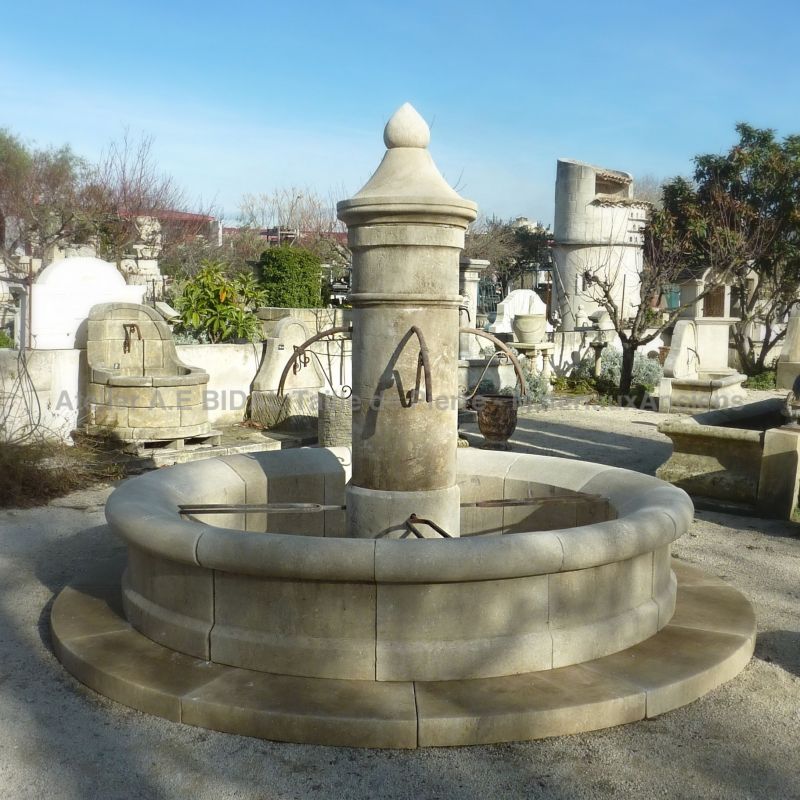 Imposing round stone fountain | Stone fountain crafted by Alain BIDAL in Provence.